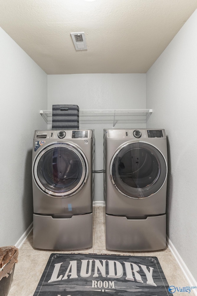 laundry room with washer and dryer