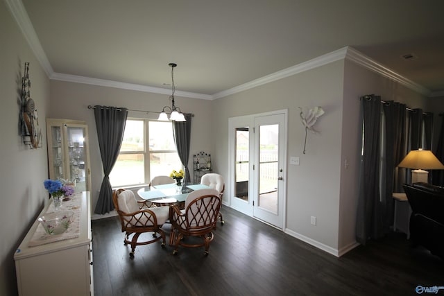 dining area featuring baseboards, an inviting chandelier, ornamental molding, and dark wood-type flooring
