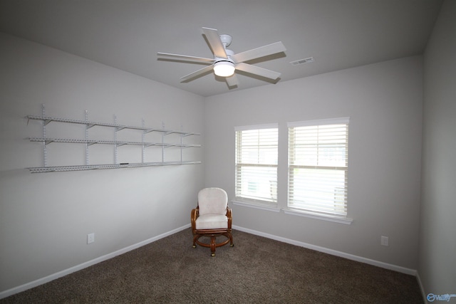 unfurnished room featuring baseboards, ceiling fan, carpet, and visible vents