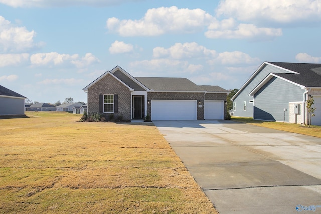 view of front of property with a garage and a front yard