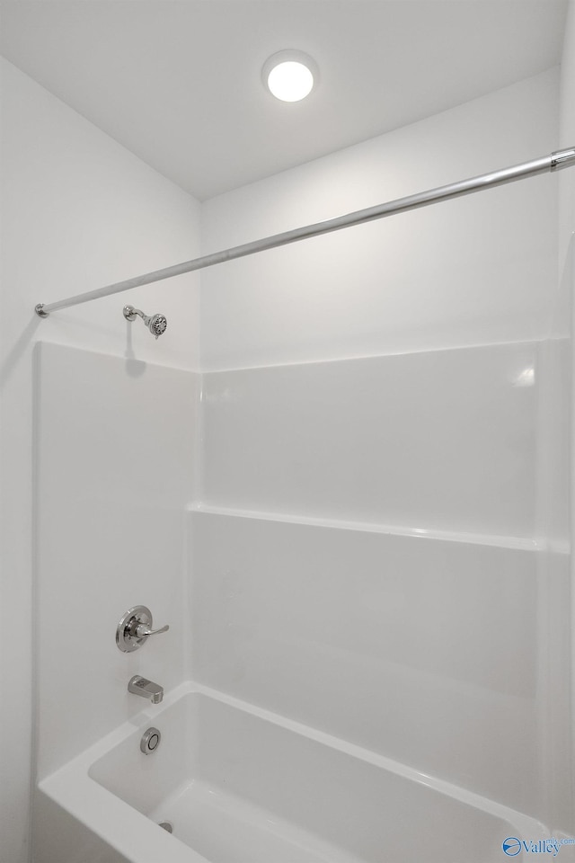 bathroom with shower / tub combination