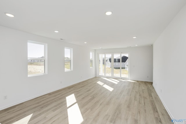 spare room featuring light wood-type flooring