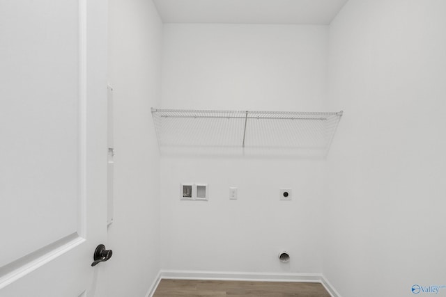 laundry room with wood-type flooring, electric dryer hookup, and washer hookup