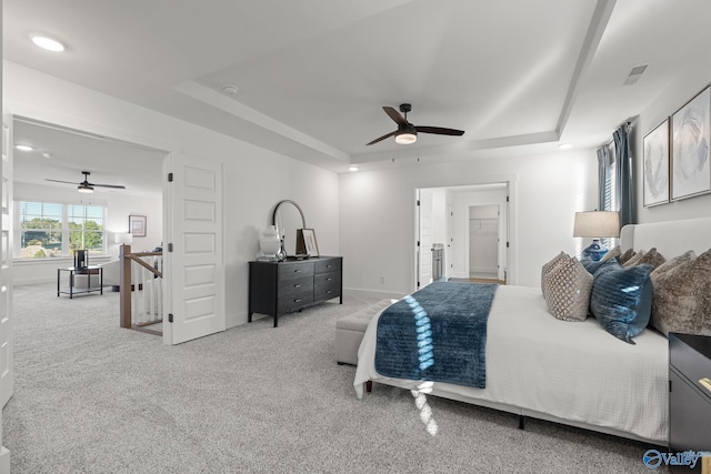 bedroom featuring baseboards, a raised ceiling, and carpet flooring