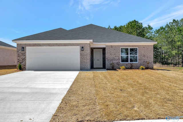 single story home with brick siding, an attached garage, driveway, and a front yard