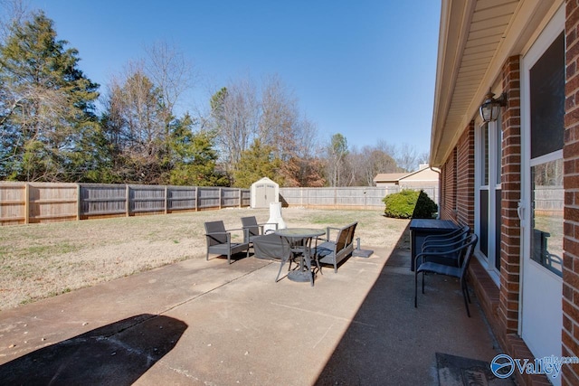 view of patio / terrace featuring a storage unit