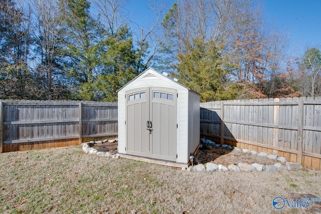 view of outbuilding with a yard