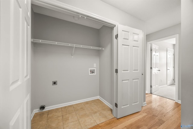 clothes washing area with washer hookup, hardwood / wood-style floors, and hookup for an electric dryer