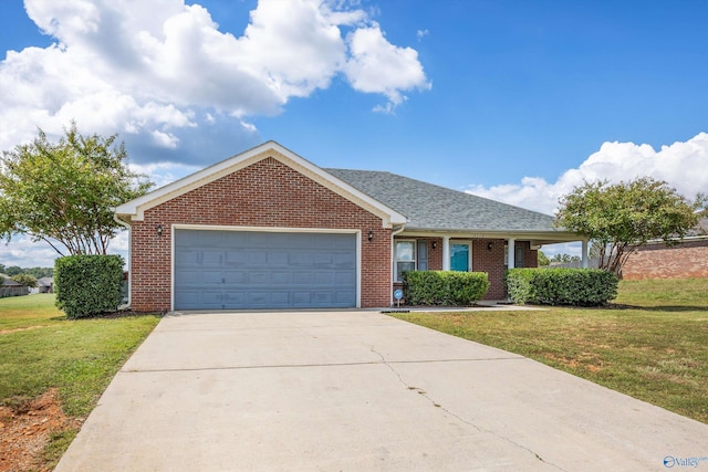 ranch-style house featuring a garage and a front yard