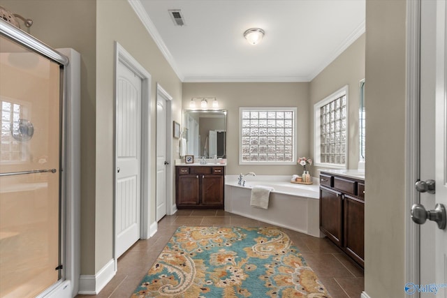 bathroom featuring tile patterned floors, ornamental molding, independent shower and bath, and vanity