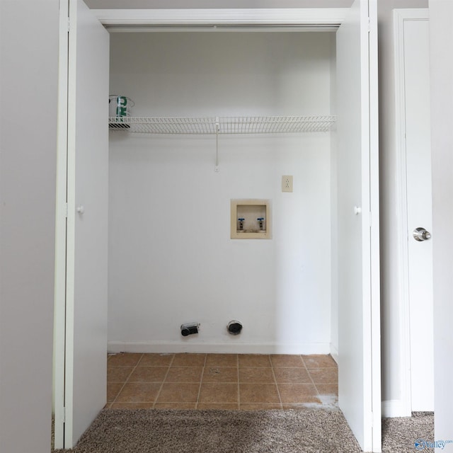 laundry room with tile patterned floors and washer hookup