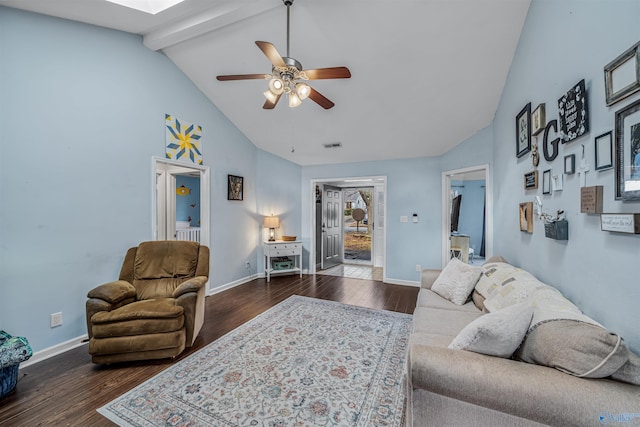 living room with dark hardwood / wood-style floors, high vaulted ceiling, a skylight, beamed ceiling, and ceiling fan