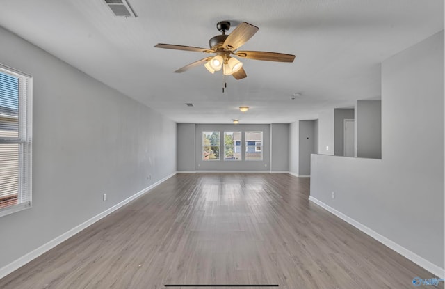 spare room featuring light hardwood / wood-style floors and ceiling fan