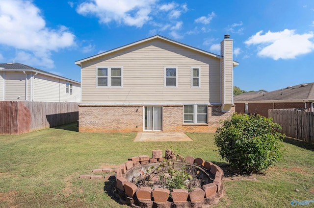 rear view of house with a lawn