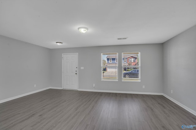 empty room featuring wood-type flooring