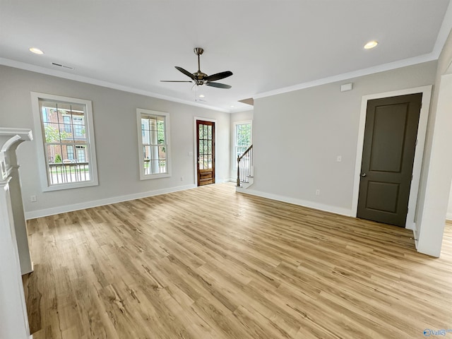 unfurnished living room with light hardwood / wood-style floors, crown molding, and ceiling fan