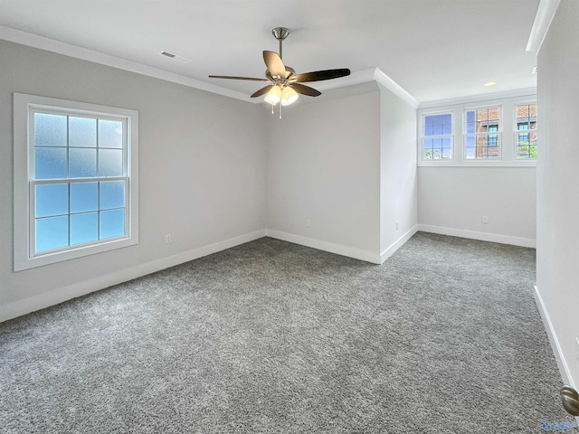 carpeted empty room featuring crown molding and ceiling fan