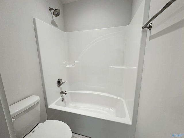 bathroom with shower / washtub combination and toilet