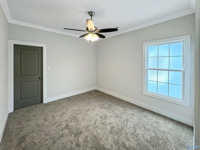 carpeted empty room with crown molding and ceiling fan