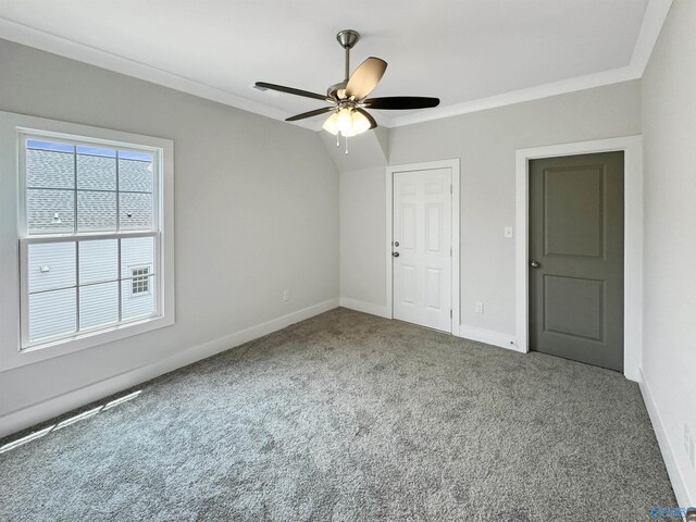 unfurnished bedroom with crown molding, ceiling fan, carpet flooring, and a closet