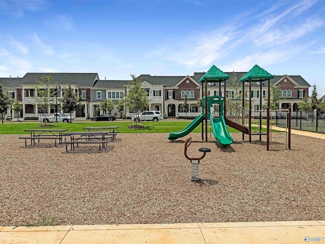 view of jungle gym featuring a lawn