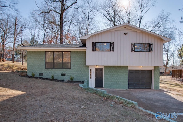 split level home with a garage