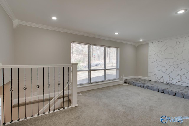 unfurnished bedroom featuring ornamental molding and light carpet