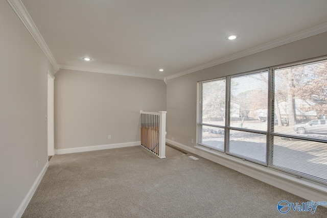 carpeted spare room with ornamental molding