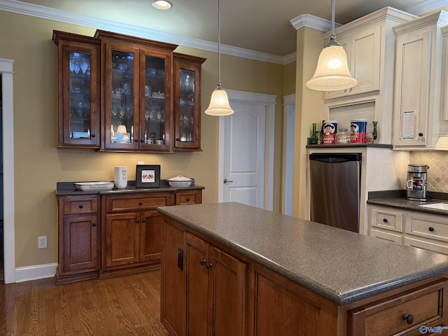 kitchen with glass insert cabinets, refrigerator, dark countertops, pendant lighting, and dark wood-style flooring