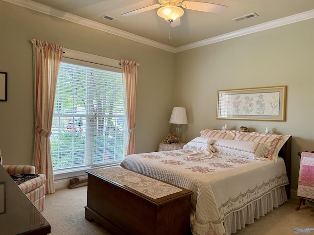 bedroom featuring light colored carpet, crown molding, ceiling fan, and visible vents