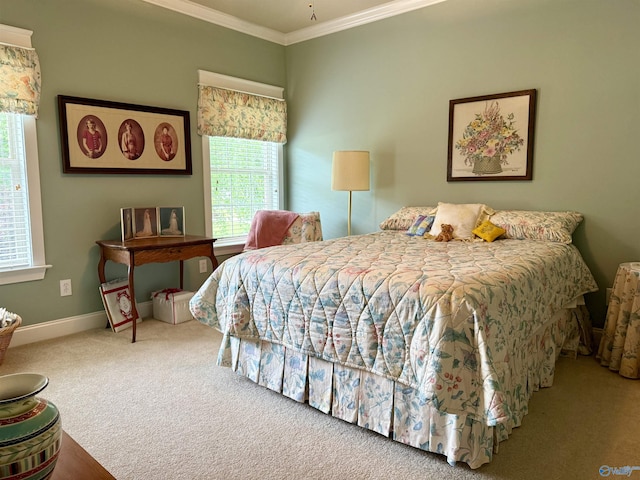 bedroom with crown molding, multiple windows, baseboards, and carpet