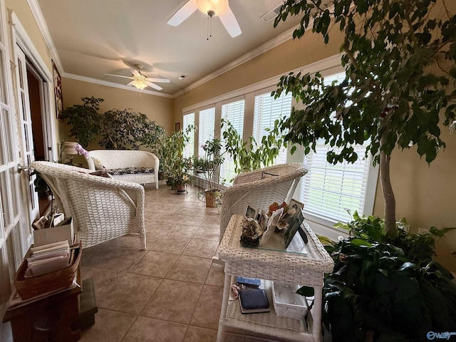 sunroom / solarium featuring crown molding and tile patterned floors