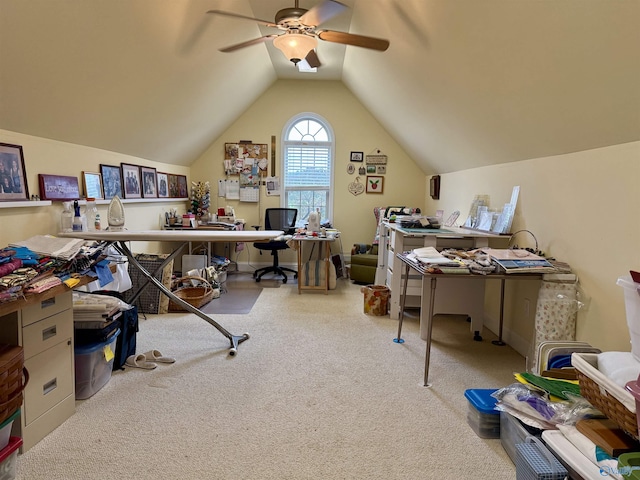carpeted office space with vaulted ceiling and ceiling fan