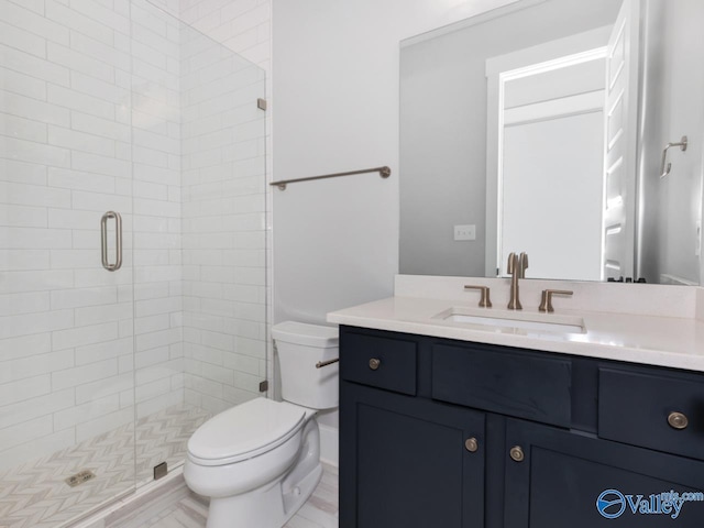 bathroom featuring walk in shower, vanity, and toilet