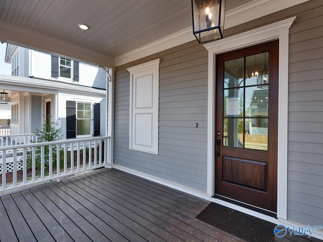 view of exterior entry with a porch