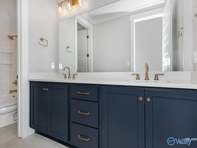 full bathroom with vanity, tile patterned flooring, tiled shower / bath combo, and toilet