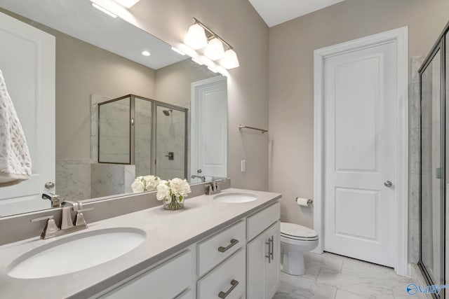 full bath featuring double vanity, a shower stall, marble finish floor, and a sink