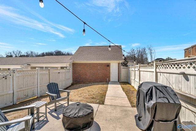 view of patio featuring area for grilling and a fenced backyard