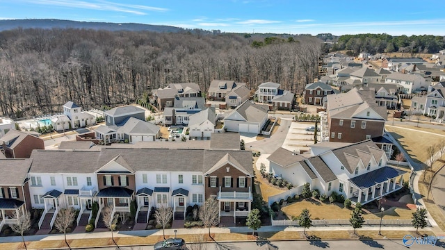 aerial view featuring a view of trees and a residential view