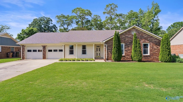 2302 Auburn Dr, Decatur, AL 35603 - single story home featuring brick siding, an attached garage, a front lawn, and driveway