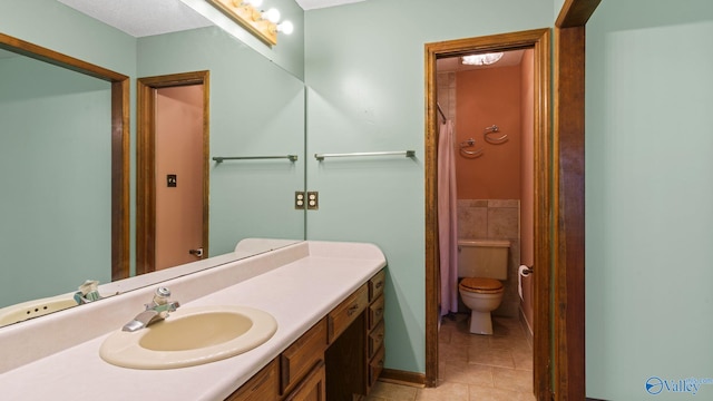 2302 Auburn Dr, Decatur, AL 35603 - full bath with tile patterned flooring, vanity, and toilet