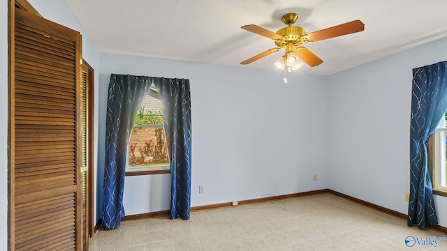 2302 Auburn Dr, Decatur, AL 35603 - unfurnished bedroom featuring baseboards, ceiling fan, a closet, and light tile patterned floors