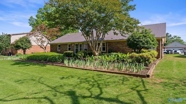 2302 Auburn Dr, Decatur, AL 35603 - back of house featuring a lawn and brick siding