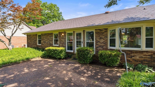2302 Auburn Dr, Decatur, AL 35603 - view of front of house featuring brick siding and a patio