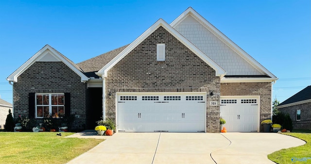 craftsman-style home with a garage and a front yard