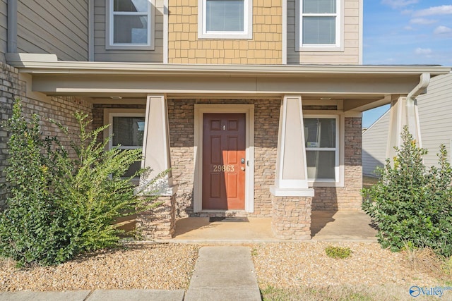 property entrance featuring a porch