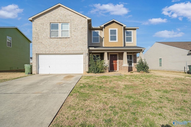 view of front of property featuring a front yard and a garage