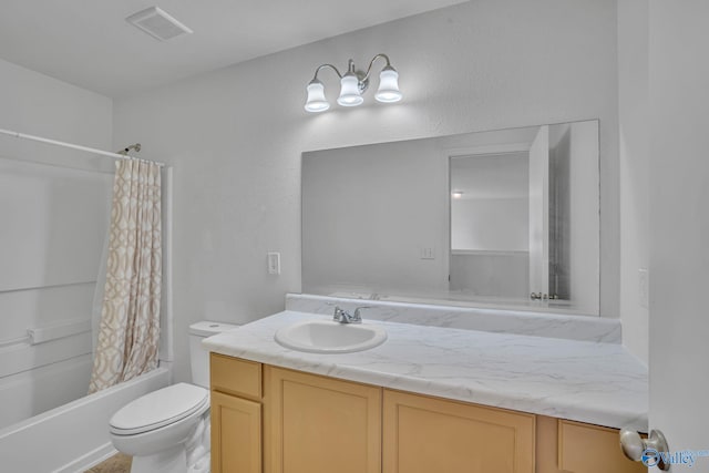 full bathroom with shower / bath combo with shower curtain, vanity, and toilet