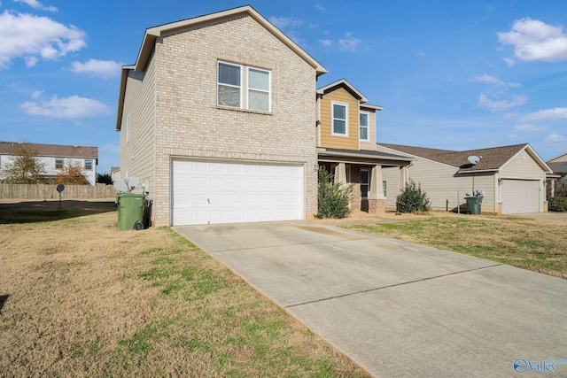 view of front of home featuring a garage and a front lawn