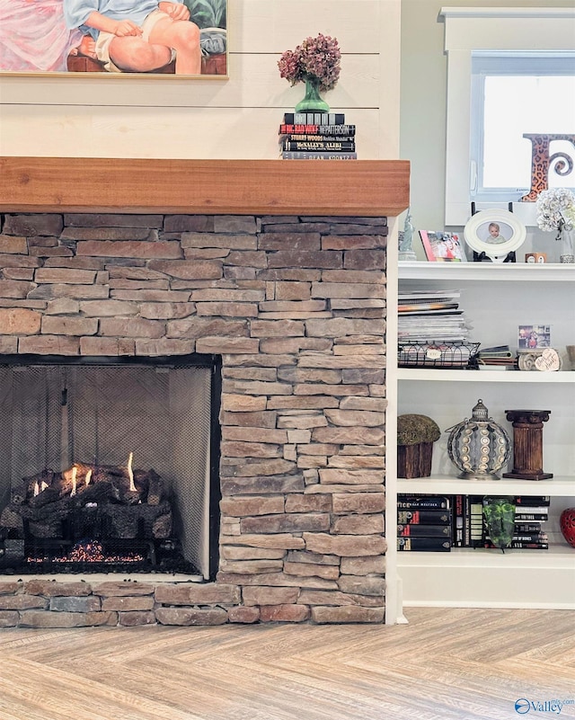 interior details featuring a stone fireplace